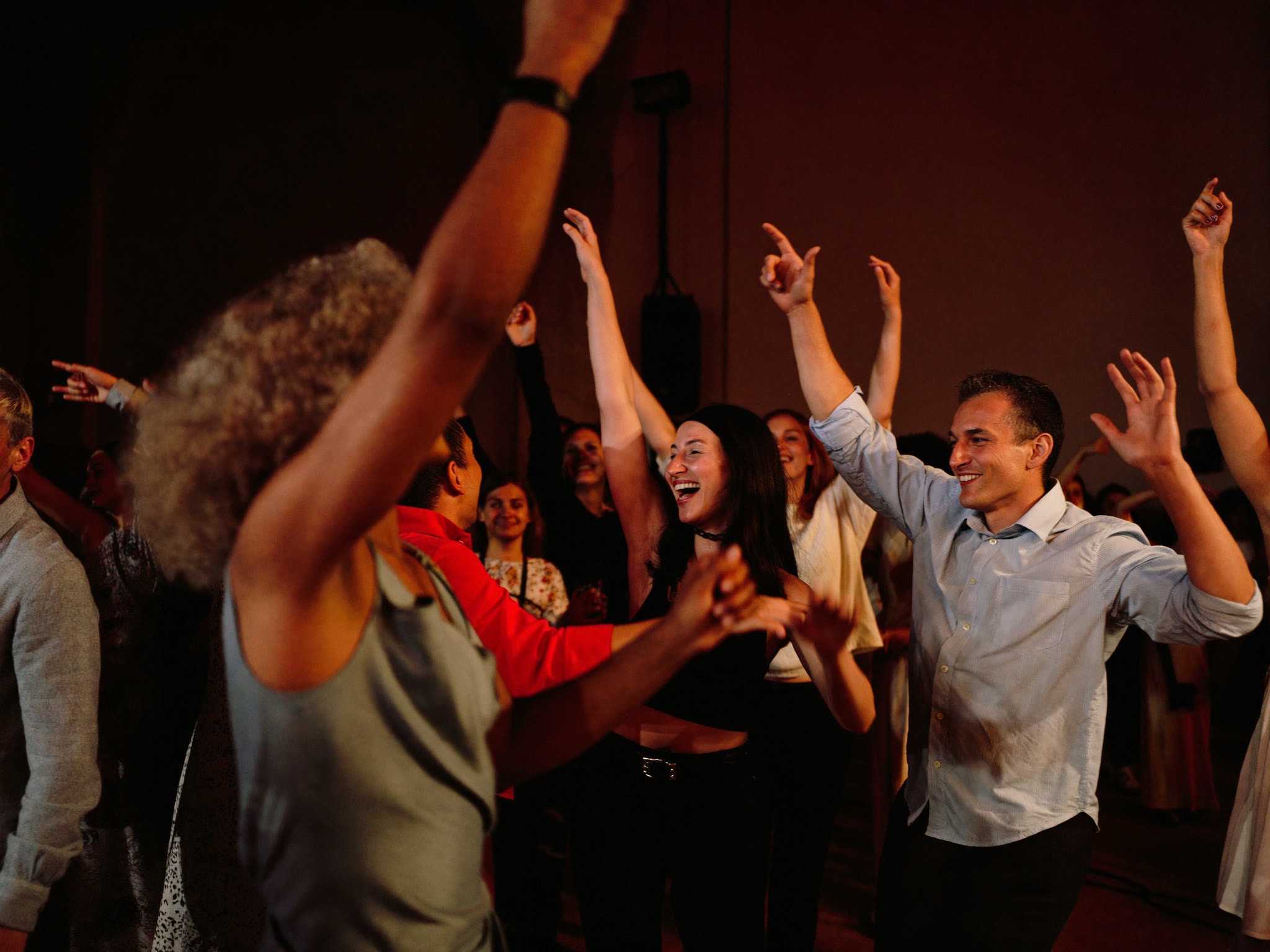 Community dancing and celebrating in The Black-E Main Space
